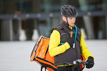 Image showing Young Courier Delivery Man Using Walkie-Talkie