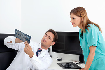 Image showing Dentist Analyzing X-Ray With Assistant