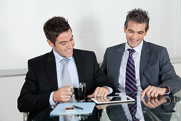 Image showing Businessmen Using Digital Tablet In Office