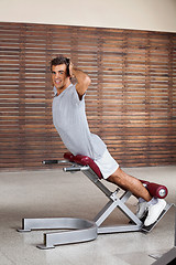 Image showing Man Exercising On Machine In Health Club