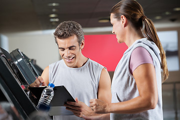 Image showing Instructor With Client In Health Club