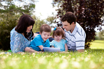 Image showing Outdoor Family with Digital Tablet