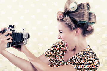 Image showing Woman holding a Vintage Camera