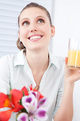 Image showing Young Woman Holding Juice Glass