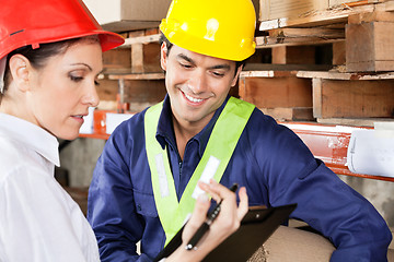 Image showing Supervisor Showing Clipboard To Foreman