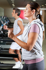 Image showing People Running On Treadmill