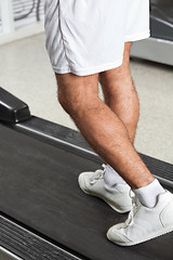 Image showing Man Walking On Treadmill In Health Club