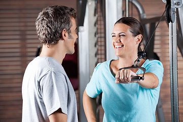 Image showing Woman Working Out While Looking At Instructor