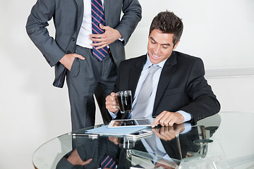 Image showing Businessman Using Digital Tablet In A Meeting With Colleague