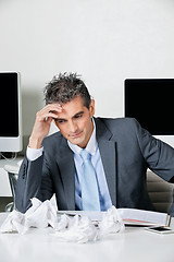 Image showing Tensed Businessman Sitting At Desk