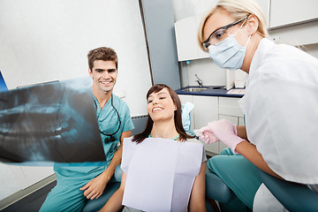 Image showing Dentist With Female Assistant Showing X-Ray Image To Patient