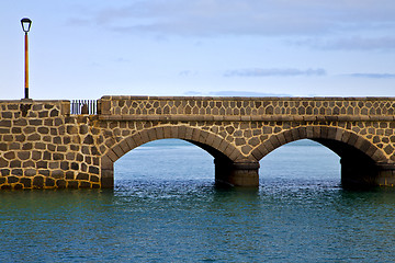 Image showing atlantic ocean lanzarote  bridge   in the blue sky    