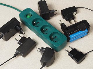 Image showing Battery chargers and extension cord