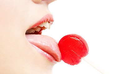 Image showing lips, tongue and candy