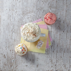 Image showing hot chocolate with marshmallows and cream on wooden background