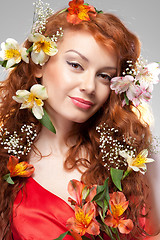 Image showing Portrait of beautiful woman with spring flowers