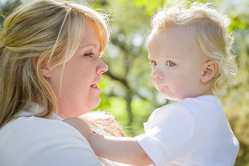 Image showing Young Mother Holding Her Adorable Baby Boy