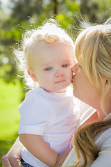 Image showing Young Mother Holding Her Adorable Baby Boy