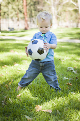 Image showing Young Cute Boy Playing with Soccer Ball in Park