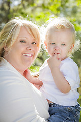 Image showing Young Mother Holding Her Adorable Baby Boy