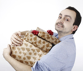 Image showing Young man holding a present