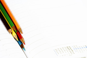 Image showing Color pencil and agenda