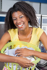 Image showing Woman With Laundry Basket At Laundromat