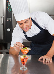 Image showing Young Chef Decorating Delicious Dessert