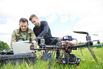 Image showing Engineers Using Laptop By UAV Octocopter