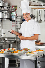 Image showing Male Chef With Clipboard At Kitchen