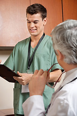 Image showing Male Technician Holding Clipboard