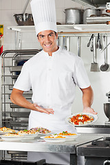 Image showing Male Chef Presenting Pasta Dish