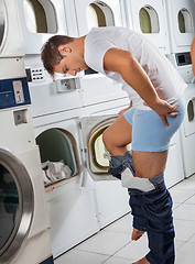 Image showing Man In Front Washing Machine