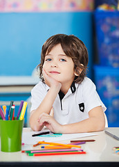 Image showing Boy Sitting With Hand On Chin In Drawing Class