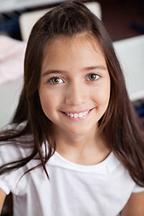 Image showing Closeup Of Schoolgirl Smiling In Classroom