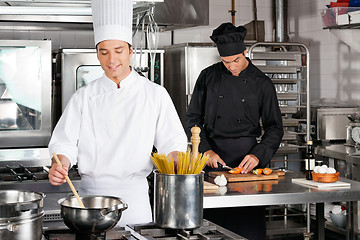 Image showing Male Chef Preparing Food