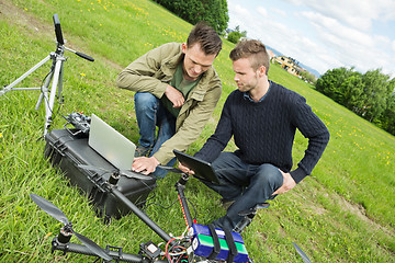 Image showing Engineers Repairing UAV Helicopter