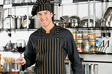 Image showing Chef Holding Glass Of Red Wine