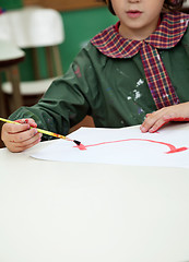 Image showing Little Boy Painting In Art Class