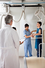 Image showing Medical Team With Patient In X-ray Room