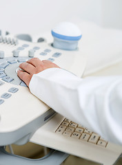 Image showing Doctor's Hand Using Ultrasound Machine