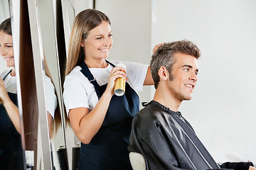 Image showing Hairstylist Setting Client's Hair At Parlor