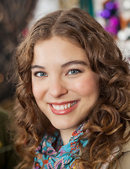 Image showing Beautiful Woman Smiling In Christmas Store