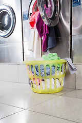 Image showing Overloaded Washing Machine And Laundry Basket