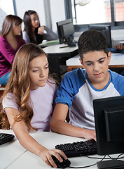 Image showing Schoolchildren Using Computer At Desk