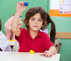 Image showing Boy Showing Clay In Classroom