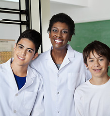 Image showing Teacher Standing With Male Students In Lab