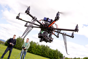 Image showing Photographer and Pilot with UAV