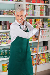 Image showing Senior Male Owner Standing Against Shelves In Supermarket