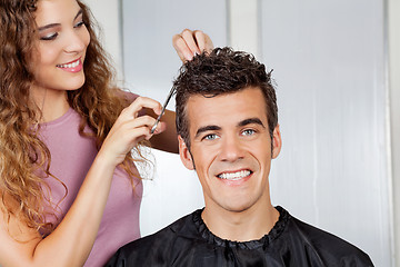 Image showing Client Getting Haircut From Hairdresser